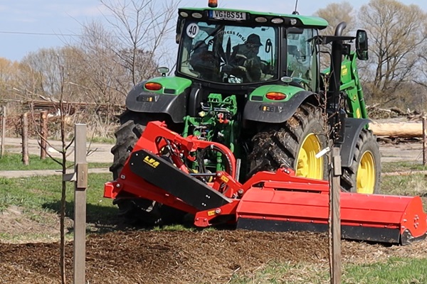 Flail mowing a compost bed with a tractor with a off-set flail mower
